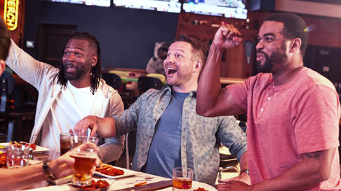 group of guys cheering