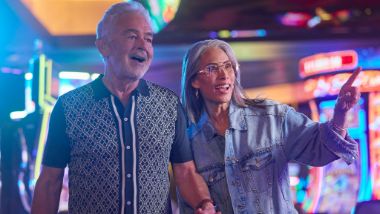older couple walking thru casino