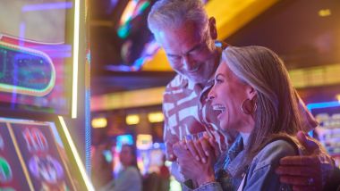 older couple at slot machine